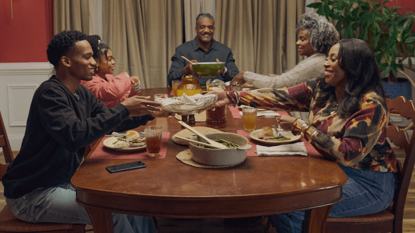 Family chatting during dinner.